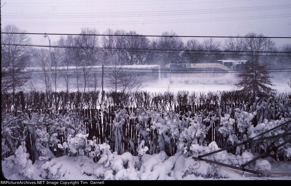 LI 267 shoves west after a heavy snowfall.